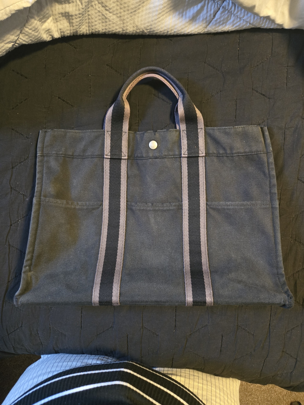 Hermès Fourre Tout canvas tote bag, featuring striped handles and a snap closure